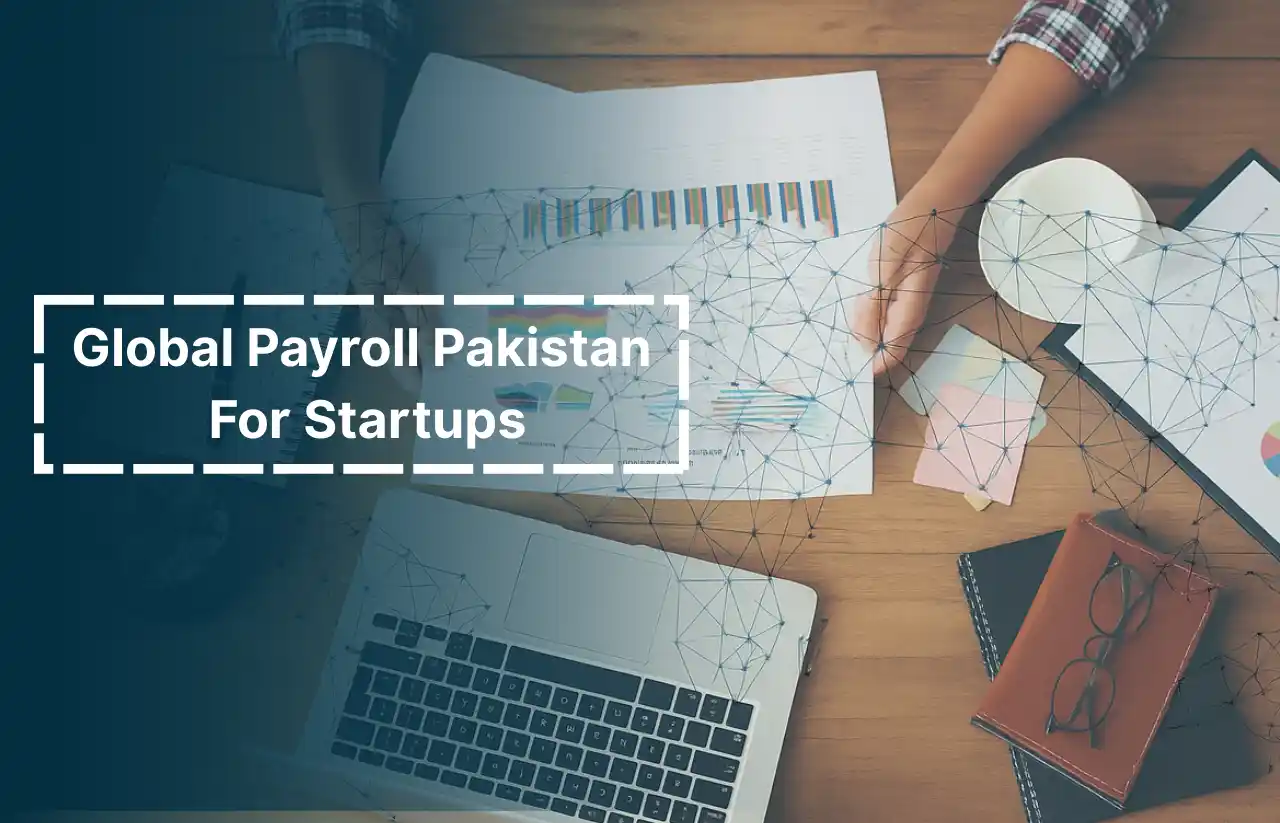 A workspace scene showing payroll charts, a laptop, and business documents on a desk, representing Global Payroll Pakistan For Startups services offered by Remire.