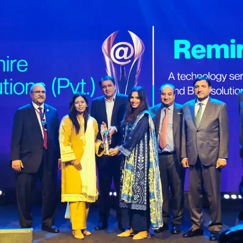 Remire Solutions team receiving the "Winner" award at the Tech Nation Pakistan ceremony, representing a milestone year of corporate achievement and government recognition.