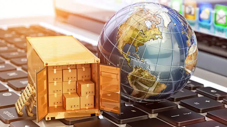 A Remire global logistics and Payroll Panagement Case Study graphic, showcasing a miniature open shipping container filled with cardboard boxes next to a translucent earth globe resting on a laptop keyboard.